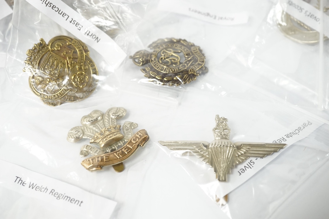 Fifty military cap badges including; the Norfolk regiment, the 16th Queen’s Lancers, Army Education Corps, Bedfordshire Yeomanry, Princess Victoria‘s Royal Irish Fusiliers, Northamptonshire Yeomanry, Royal Naval Division